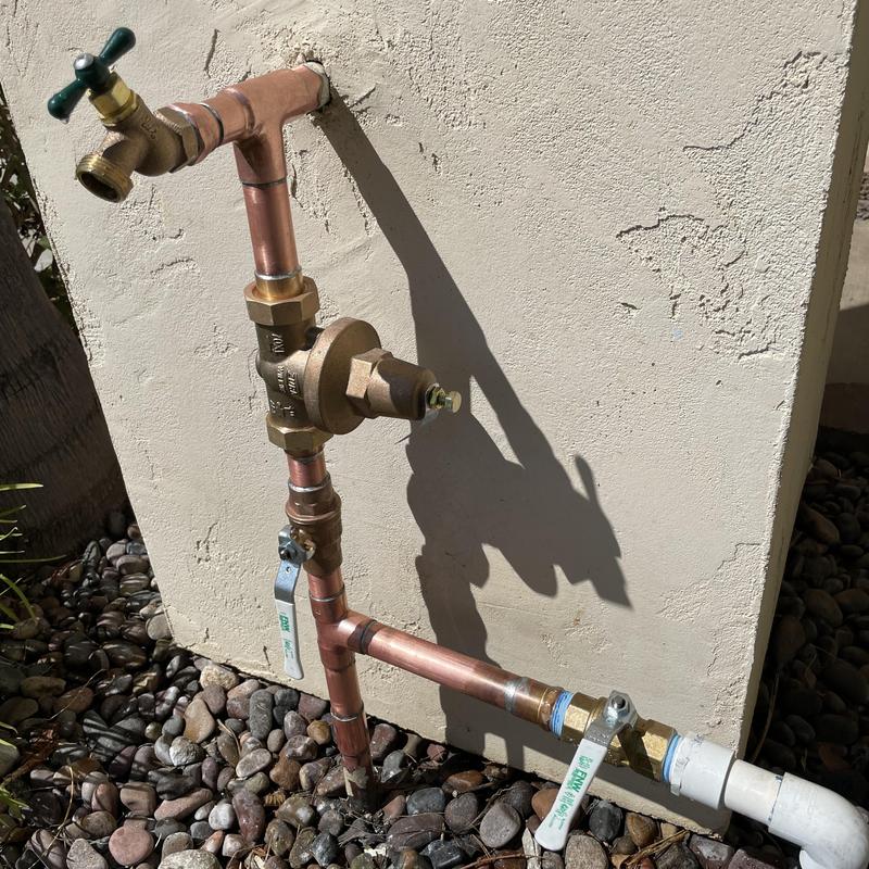 Wilkins pressure regulator with ball valves and hose bib