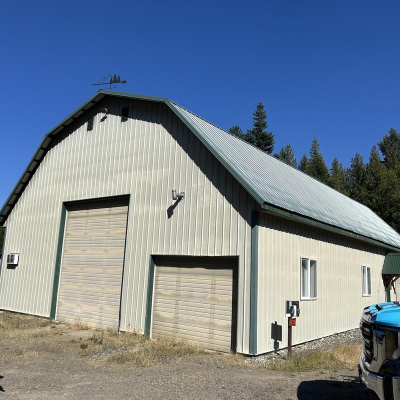Barn metal roof with replaced screws on leak repair Barn metal roof with replaced screws on leak repair