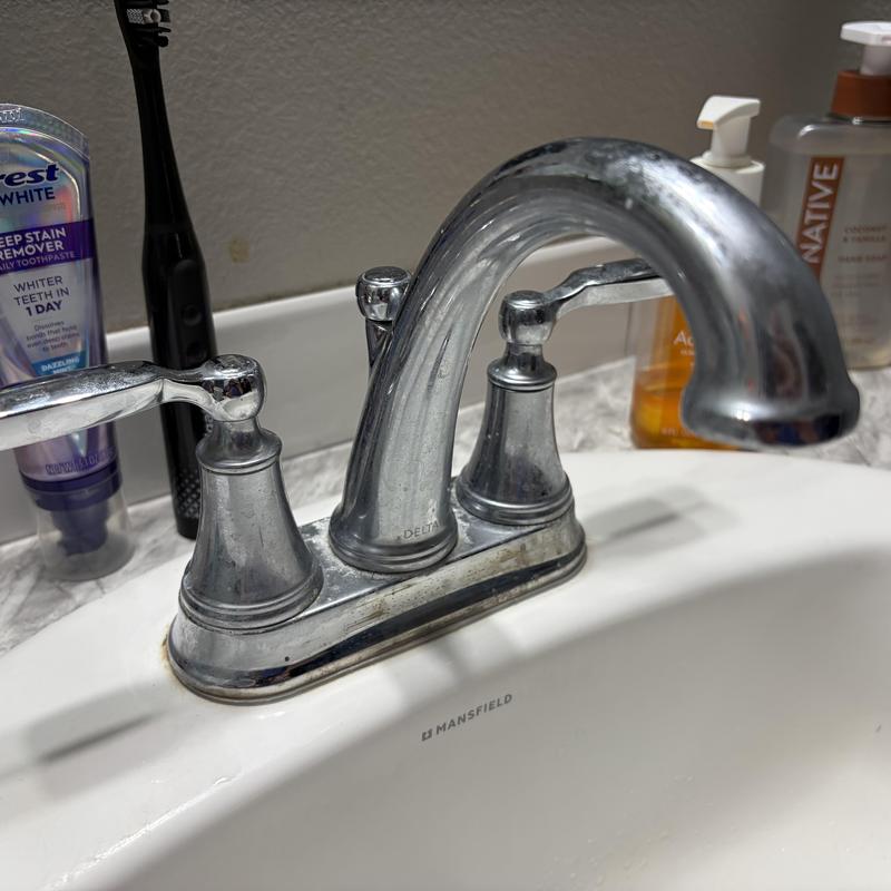 Delta two-handle faucet with hot-side leak Delta two-handle faucet with hot-side leak