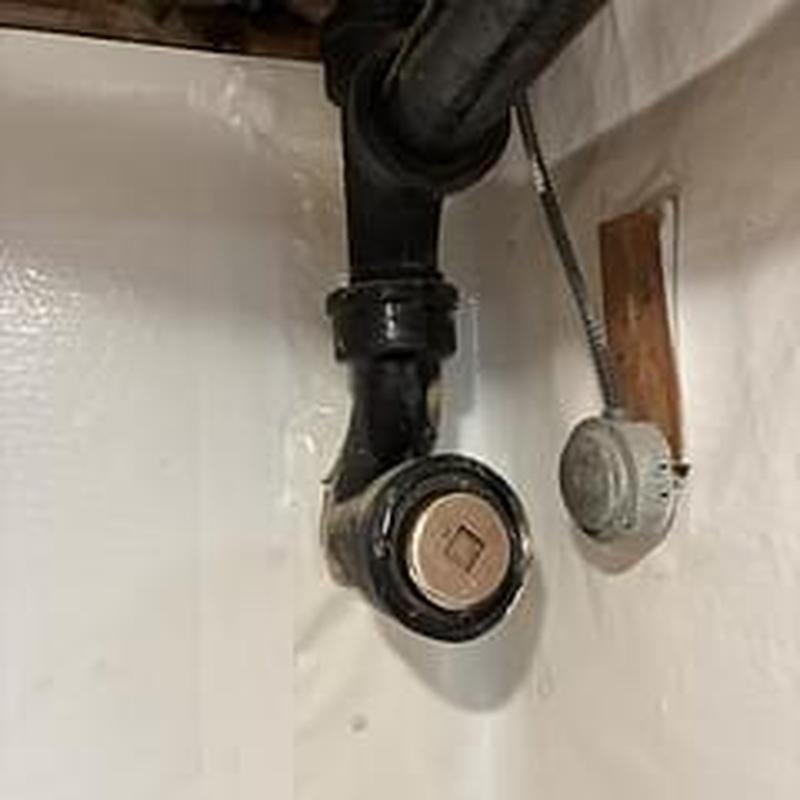 Brass cleanout on cast iron main stack pipe