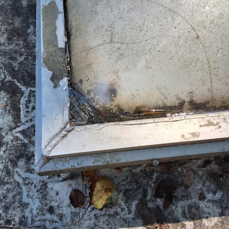 Skylight corner with water damage on TPO flat roof Skylight corner with water damage on TPO flat roof