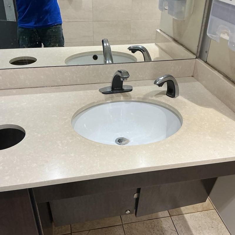 Cold supply line under bathroom sink in restroom Cold supply line under bathroom sink in restroom