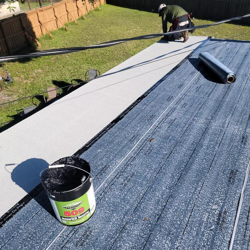Rubberized bitumen roofing membrane installation on flat roof Rubberized bitumen roofing membrane installation on flat roof