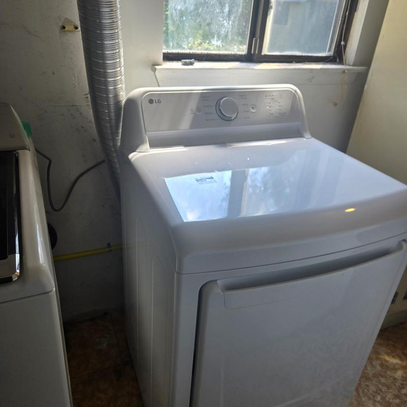 Gas dryer installation with vent and gas line