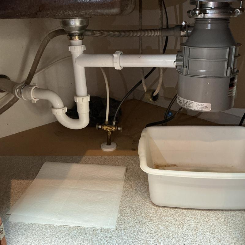 Garbage disposer and drain pipes under sink Garbage disposer and drain pipes under sink