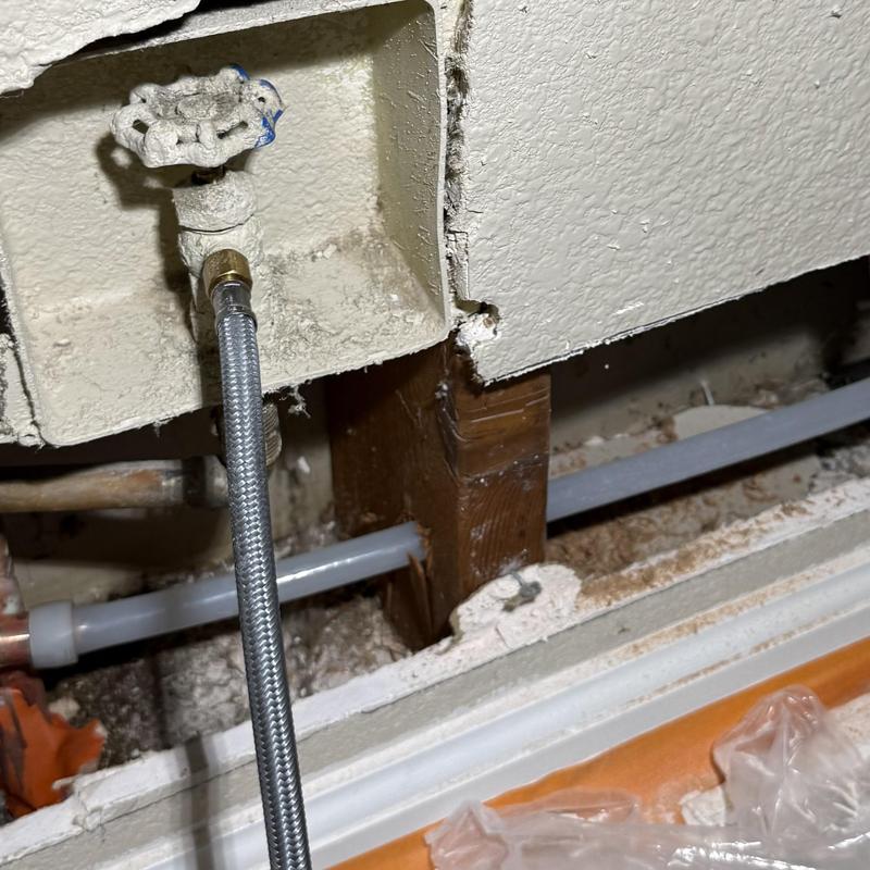 Half-inch PEX A waterline rerouted through wall studs