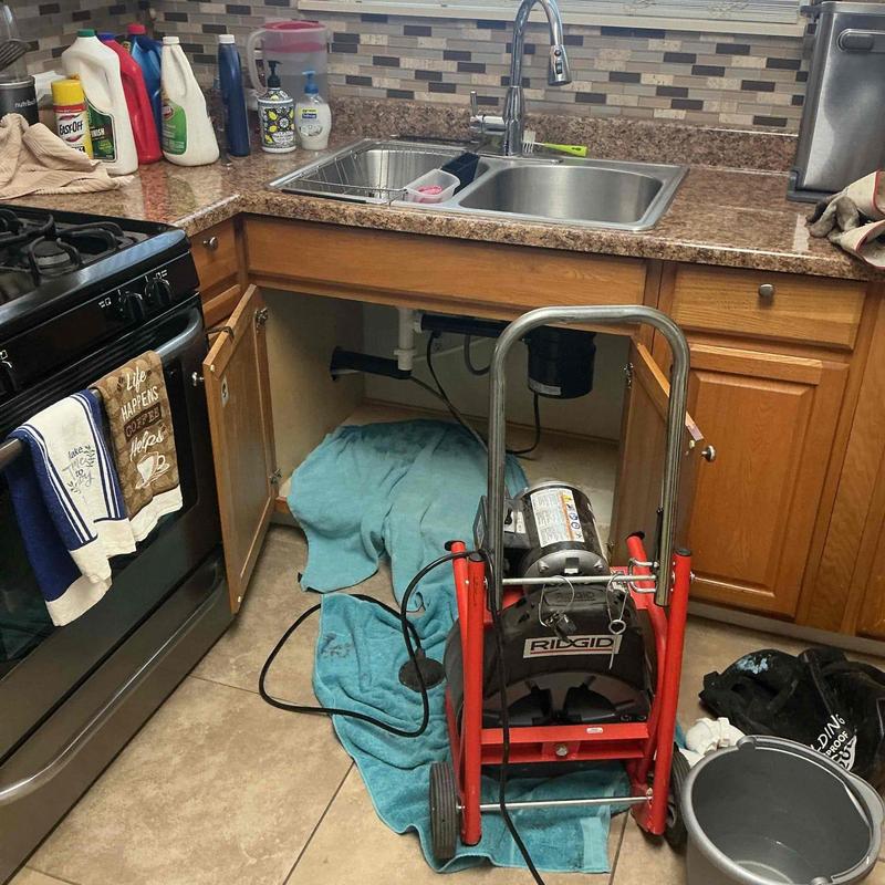 Kitchen sink main line snaking with RIDGID machine