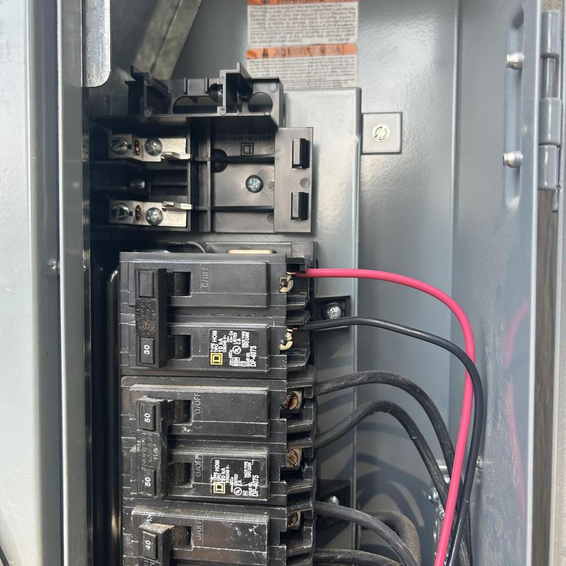 Main electrical panel with Eaton surge protector installed Main electrical panel with Eaton surge protector installed