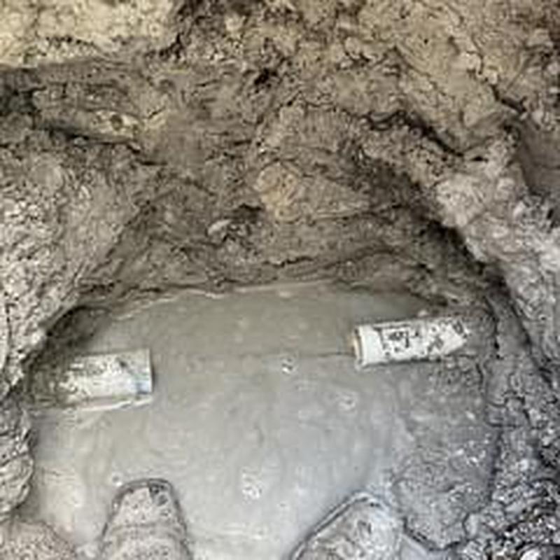 PVC pipe coupling underground repair in sidewalk excavation