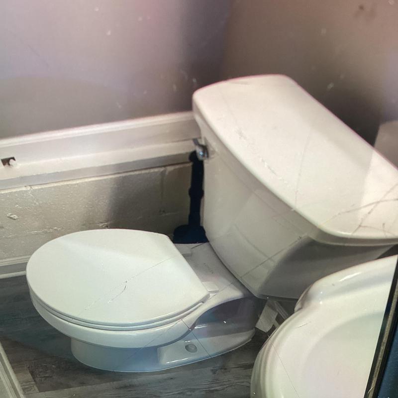 Toilet with flange repair and half moon brackets