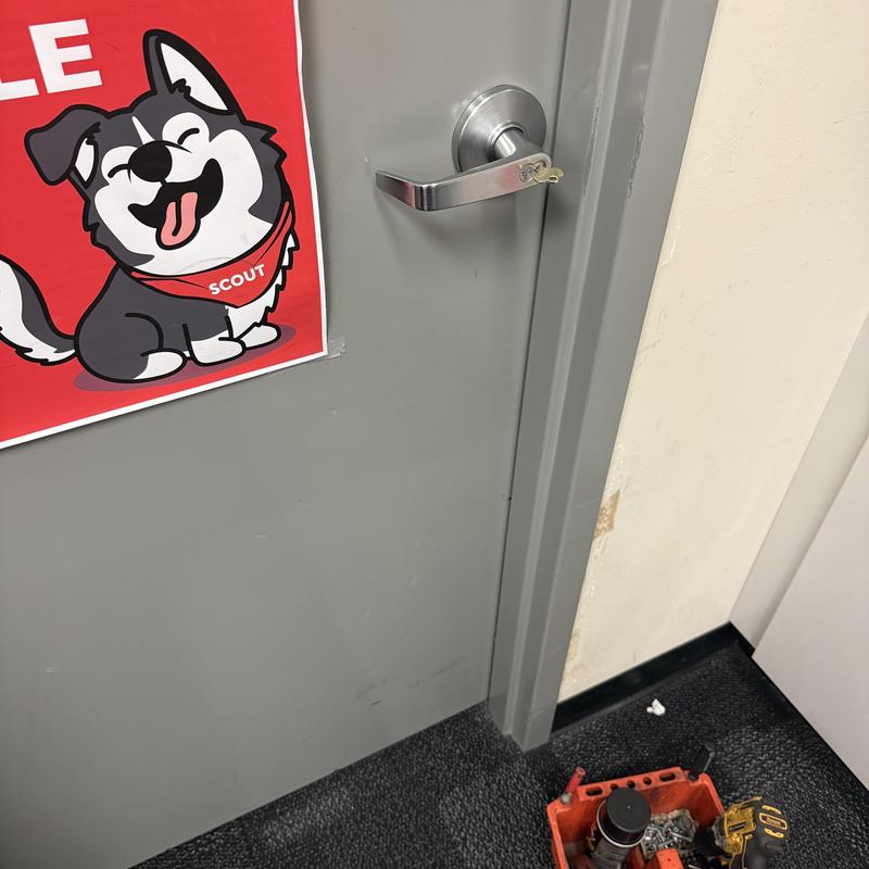 Department store cash office door lock with key inserted Department store cash office door lock with key inserted