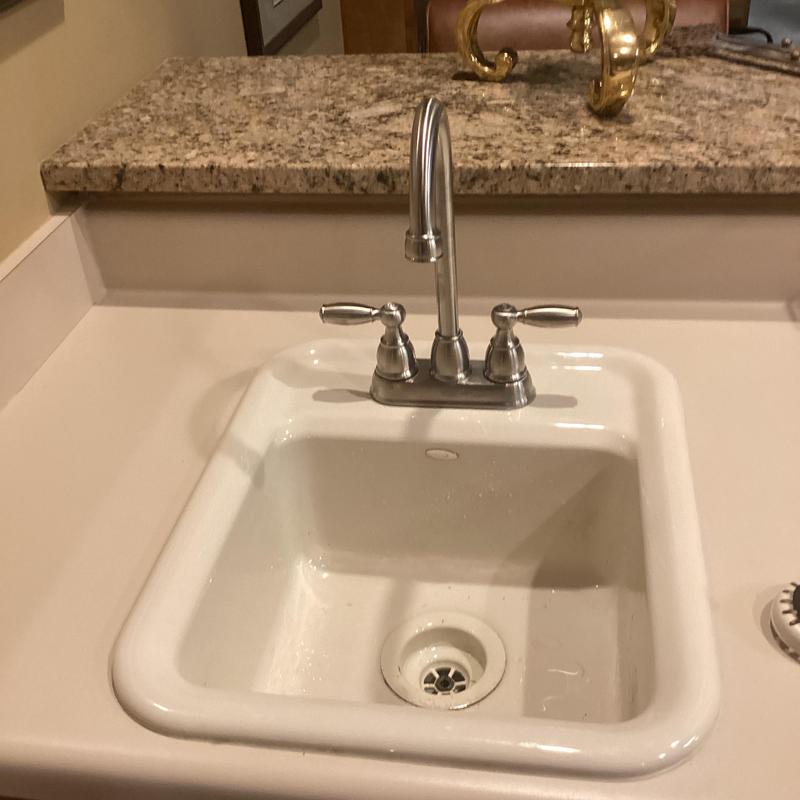 Bar faucet with new supply lines on countertop