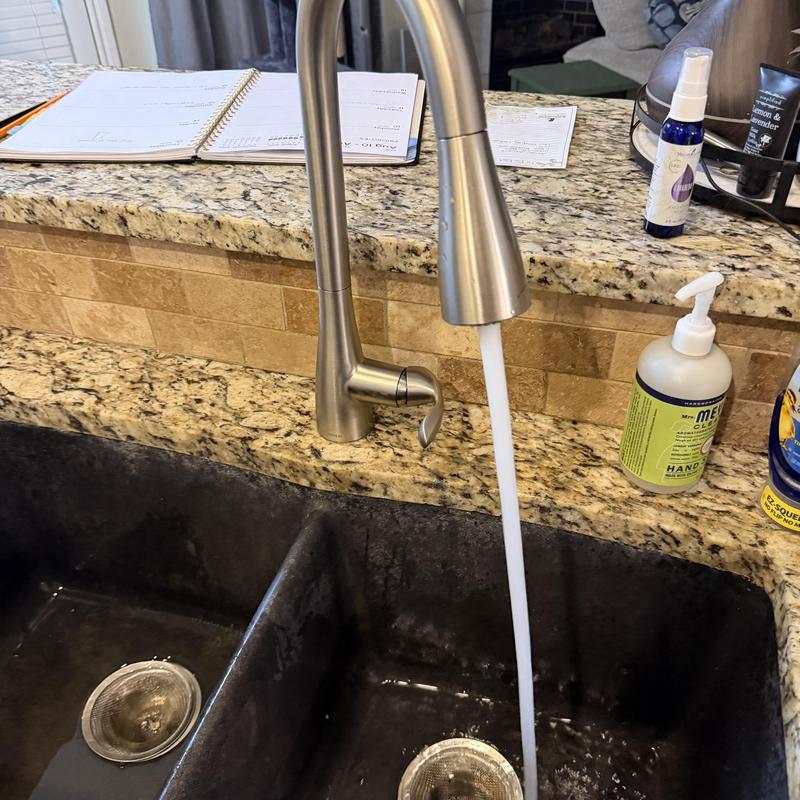 Kitchen faucet with water running into double sink Kitchen faucet with water running into double sink