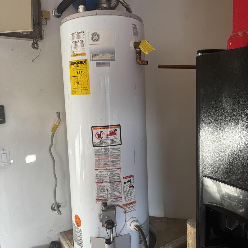 50-gallon gas water heater installation in utility room