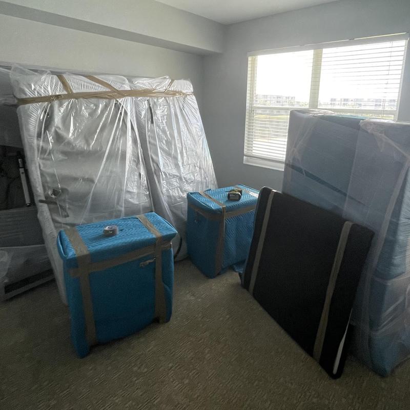 Mattresses and furniture wrapped and packed for moving
