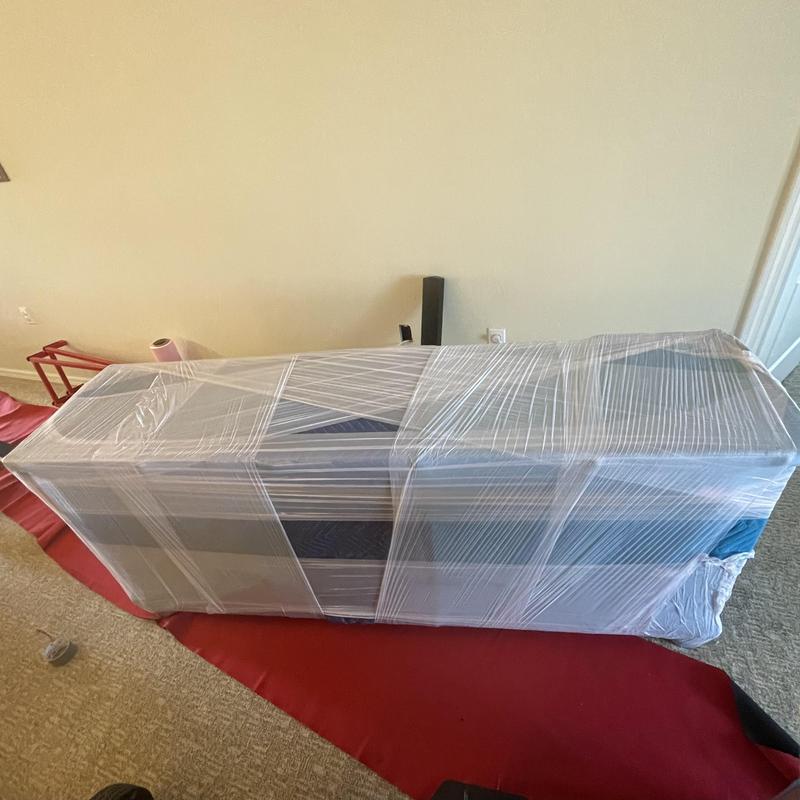 Wrapped sofa set ready for moving in Fort Myers home