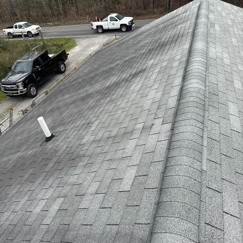 Asphalt shingle roof with hail damage inspection