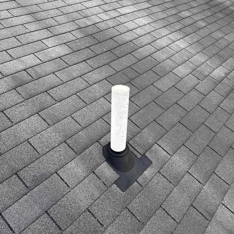 Roof vent pipe with shingle roofing and sealant