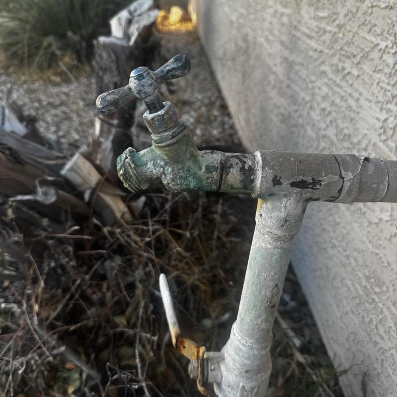 Exterior hose bib with corrosion and mineral buildup Exterior hose bib with corrosion and mineral buildup