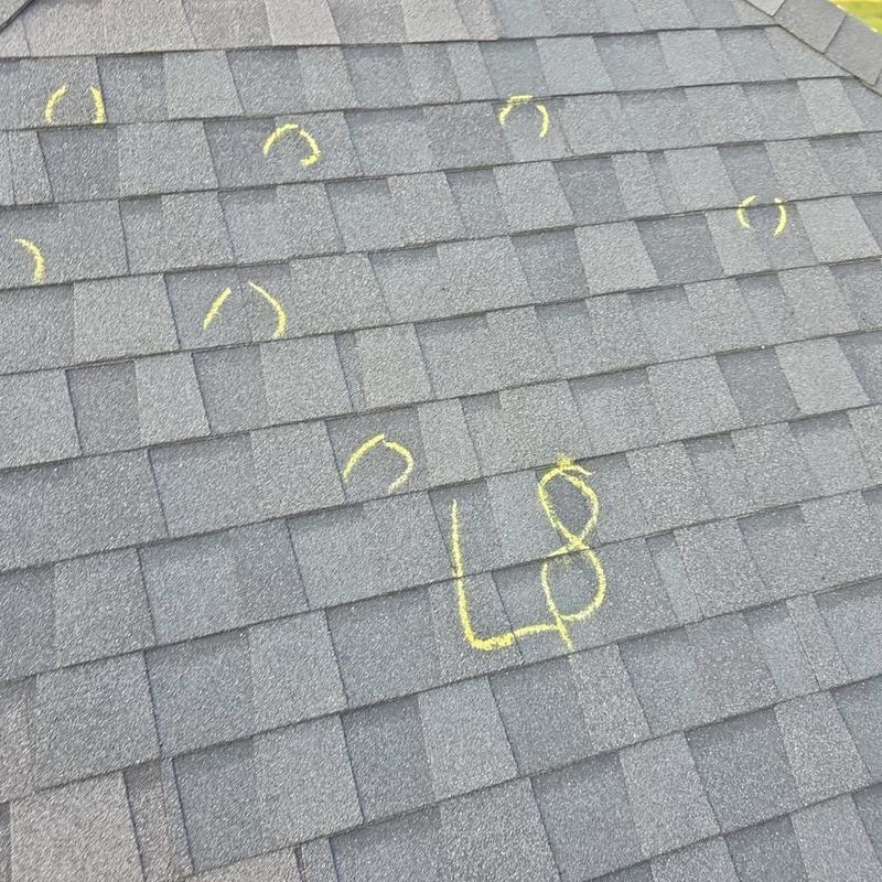 Roof shingles with hail damage markings