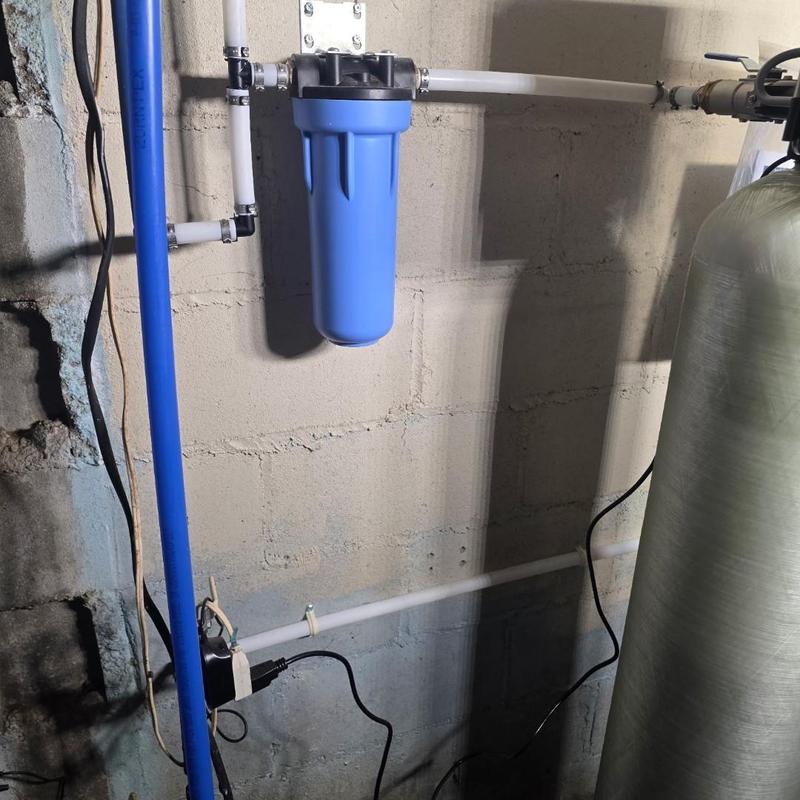 Sterling iron water filter installation in basement