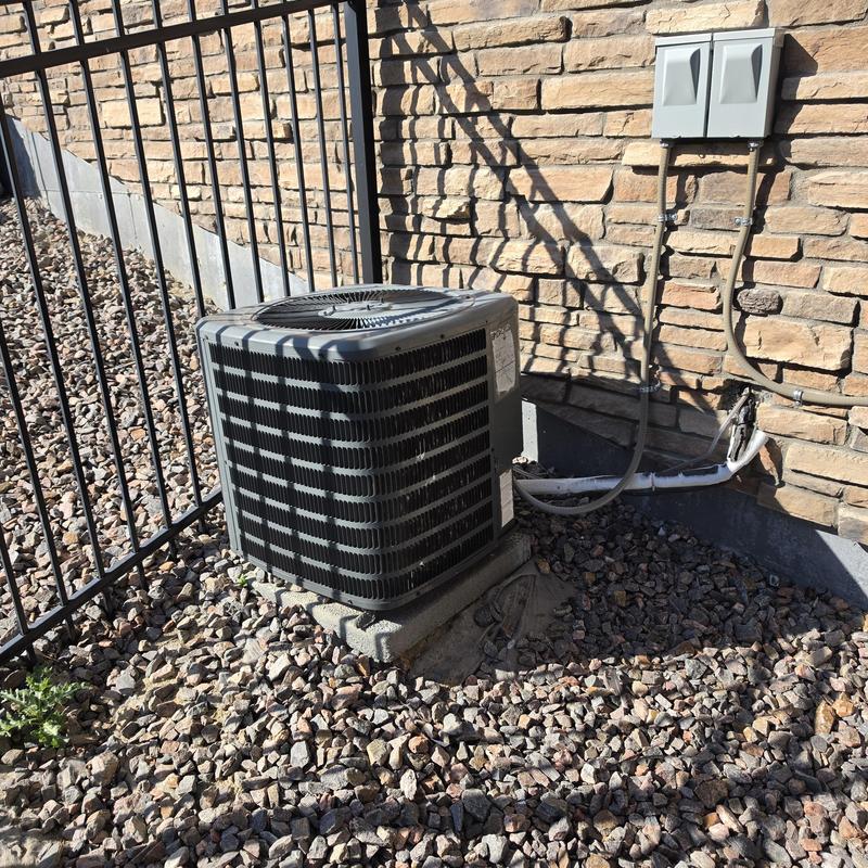 Goodman air conditioner outdoor unit on concrete pad Goodman air conditioner outdoor unit on concrete pad