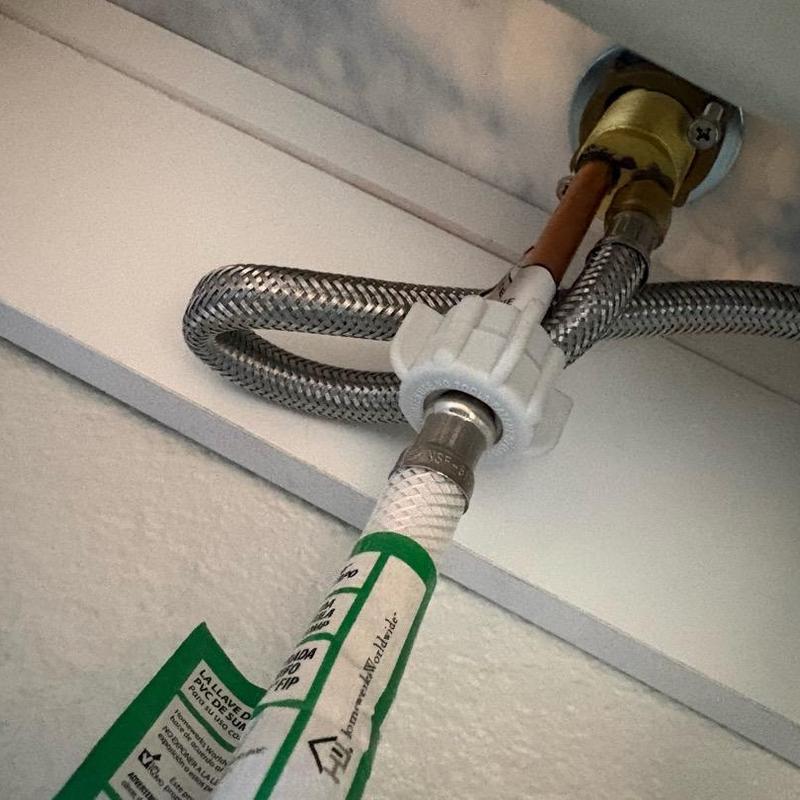 Toilet water supply line connection with braided hose