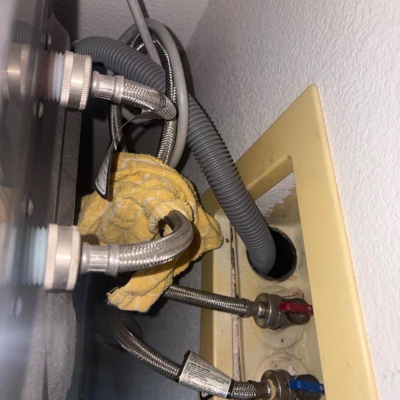 Toilet water supply lines with shutoff valves and towel