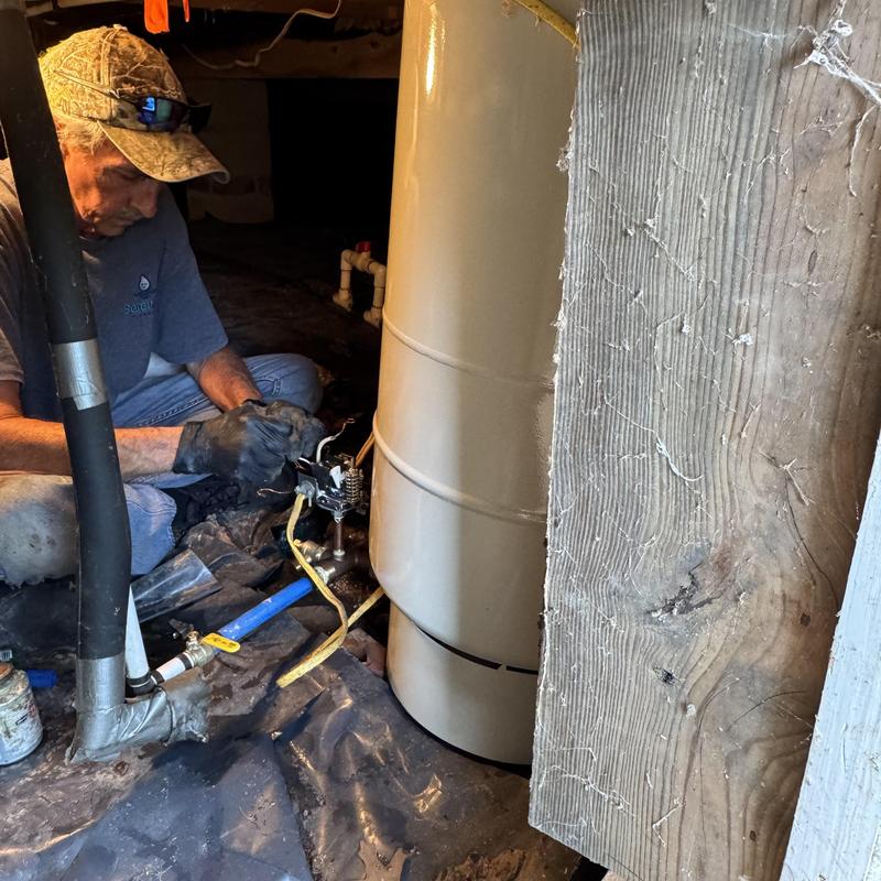 Well pressure tank installation in crawl space Well pressure tank installation in crawl space