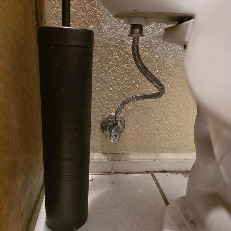 Toilet supply line installation under bathroom tank