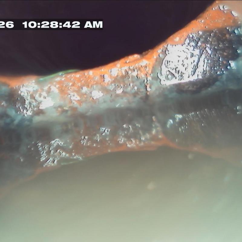 Main sewer line corrosion and buildup camera view