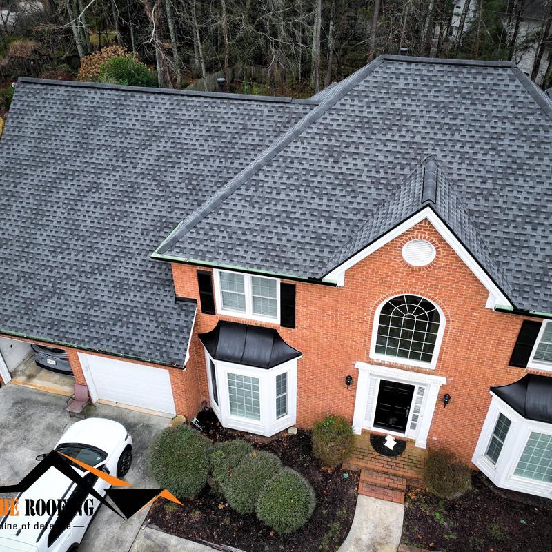 GAF Timberline HDZ charcoal roof with gutters and downspouts