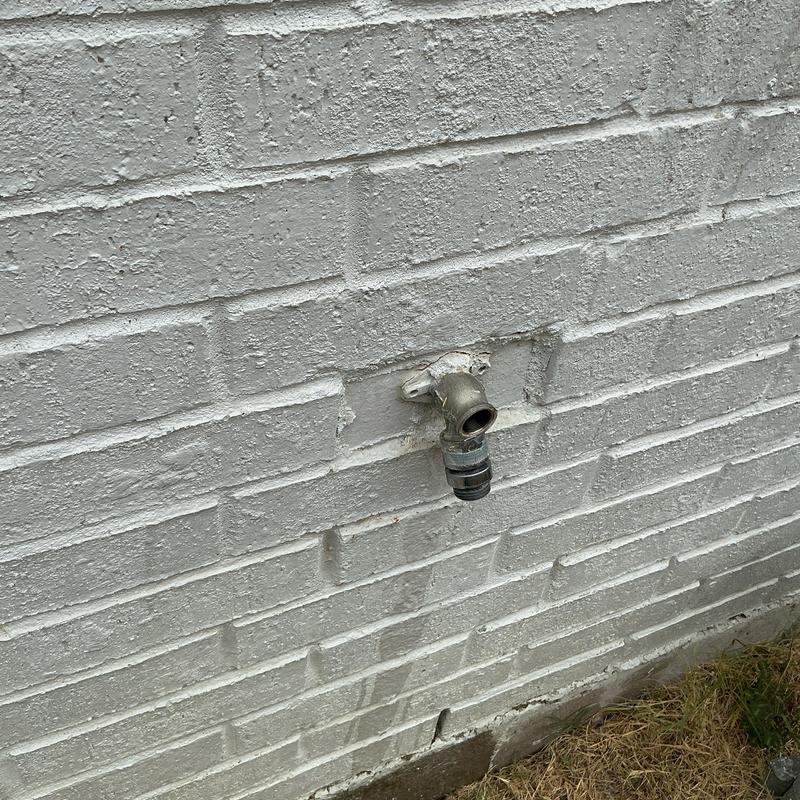 4-inch frost proof hose bib on exterior brick wall 4-inch frost proof hose bib on exterior brick wall