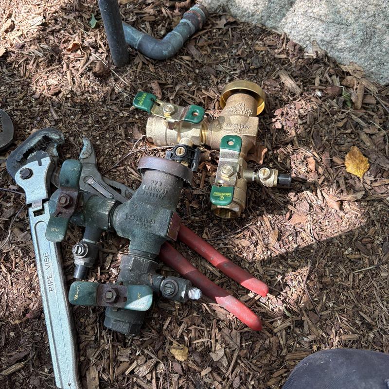 Pressure vacuum breaker backflow device with tools on ground