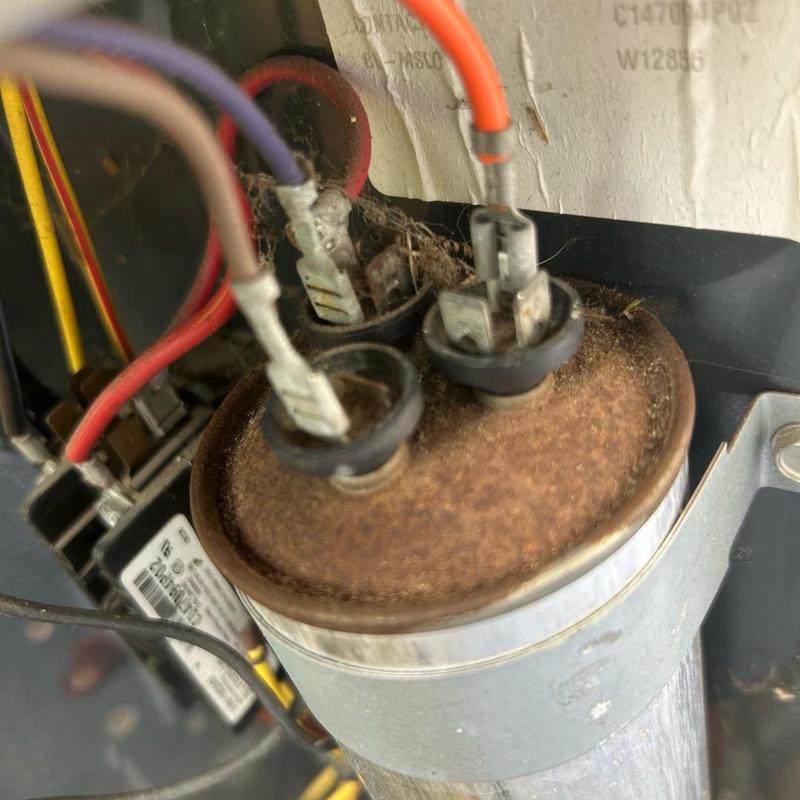 AC capacitor with corroded terminals and wiring