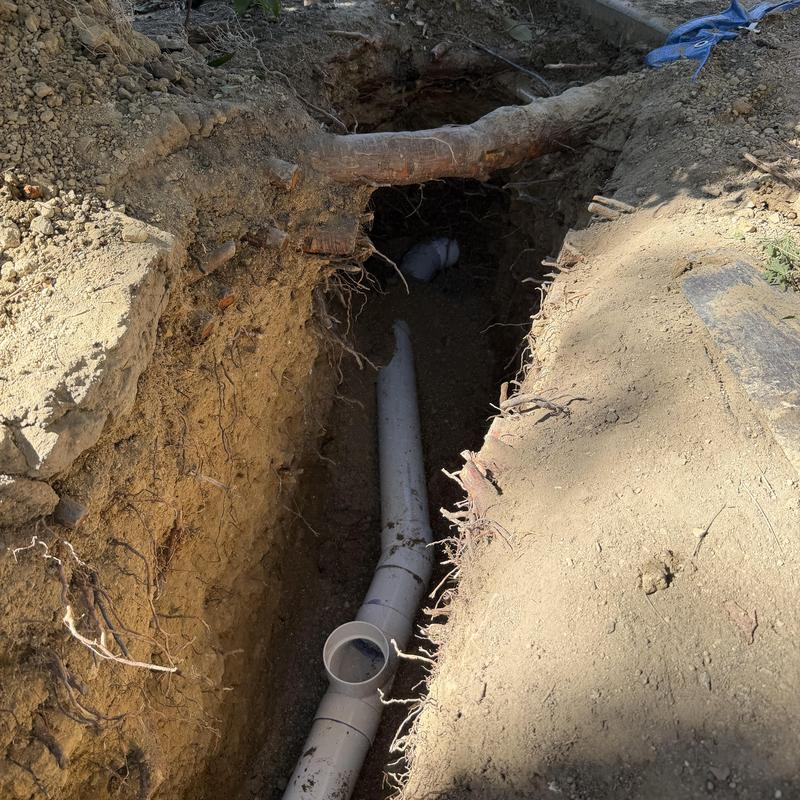 4-inch SDR 35 drain pipe reroute in trench