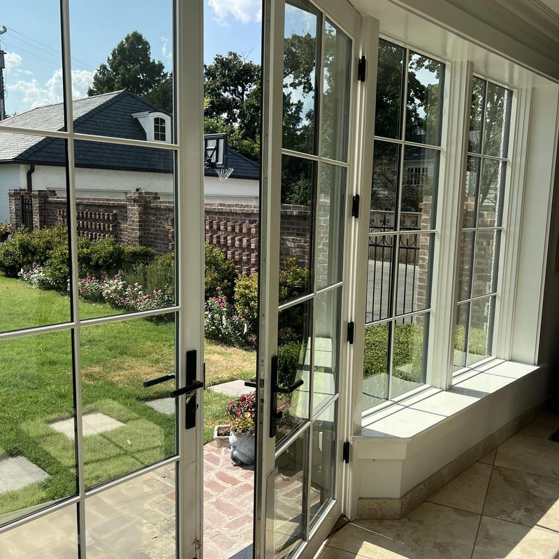 Multipoint lock on French doors with garden view Multipoint lock on French doors with garden view