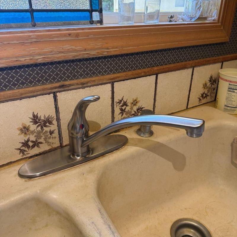 Single-handle stainless steel kitchen faucet installed