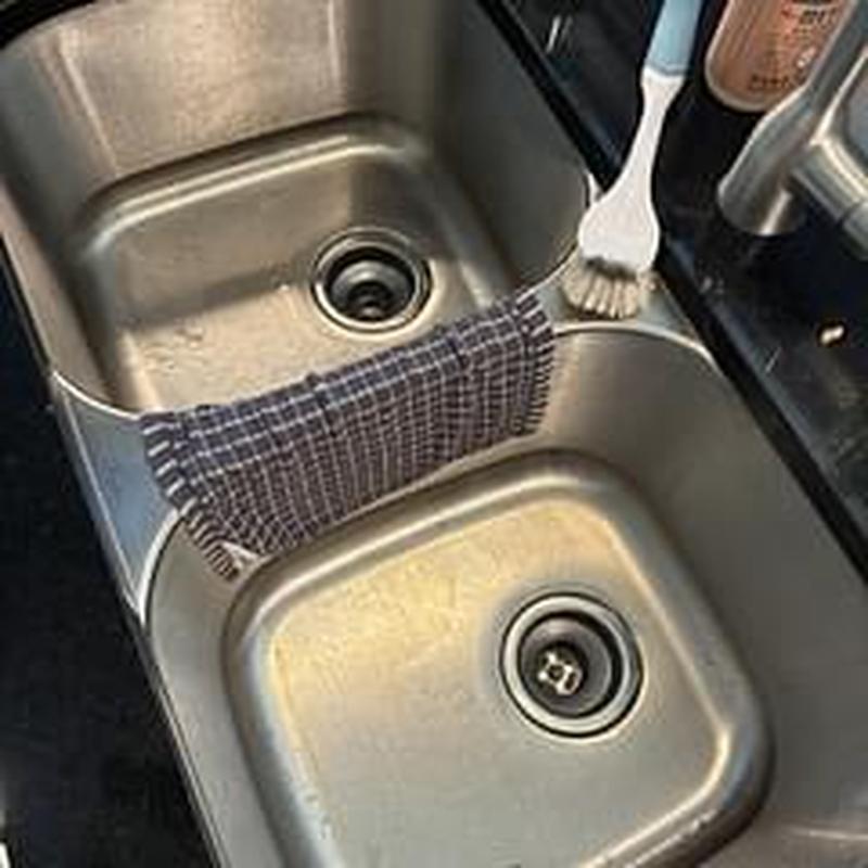 Kitchen double sink drain with cleaning brush and towel Kitchen double sink drain with cleaning brush and towel