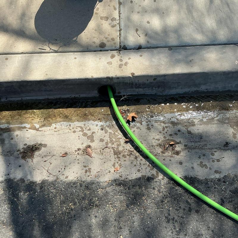 Area drain system hydro jetting with green hose