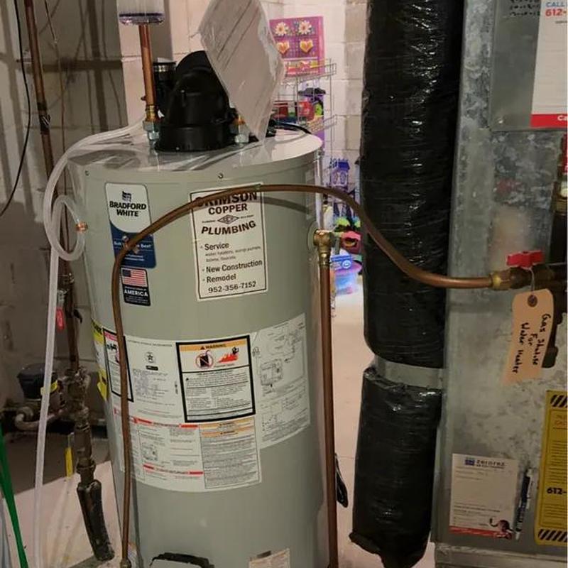 Water heater with copper piping installation in basement