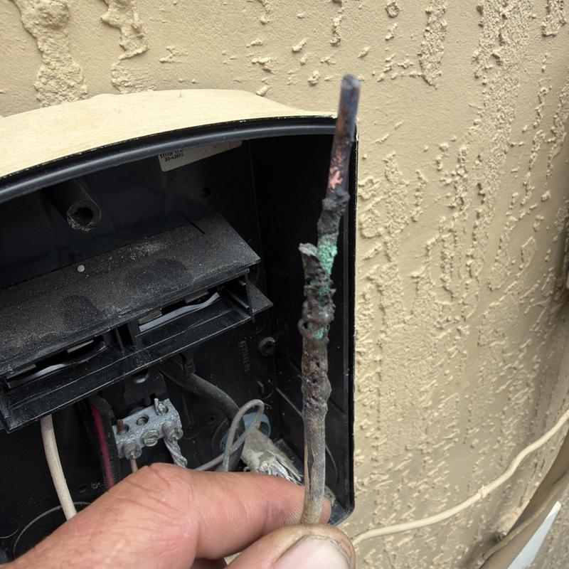 AC system high voltage disconnect wire corrosion close-up AC system high voltage disconnect wire corrosion close-up