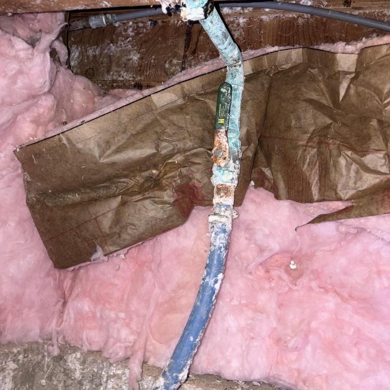 Main water shutoff valve with corrosion in crawl space