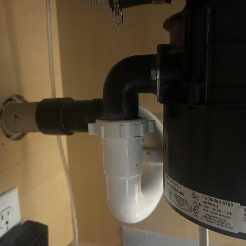 Garbage disposal drain pipe connection under sink
