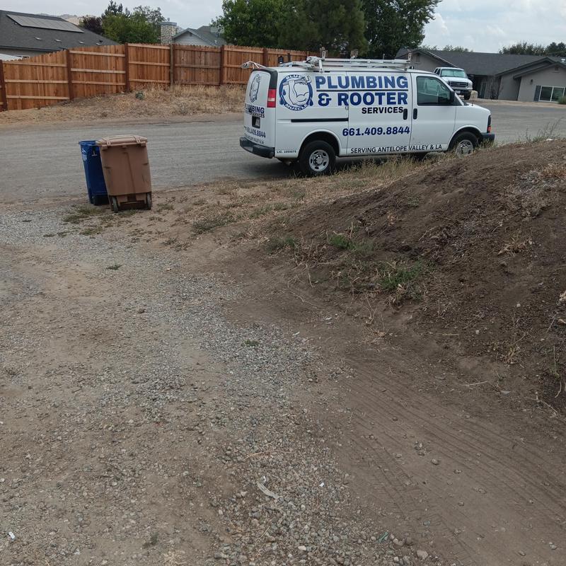 Trenchless cured-in-place liner installation site with plumbing van Trenchless cured-in-place liner installation site with plumbing van