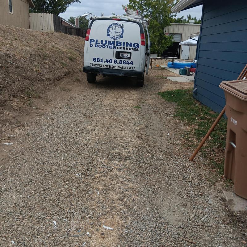 Plumbing service van parked on gravel driveway Plumbing service van parked on gravel driveway