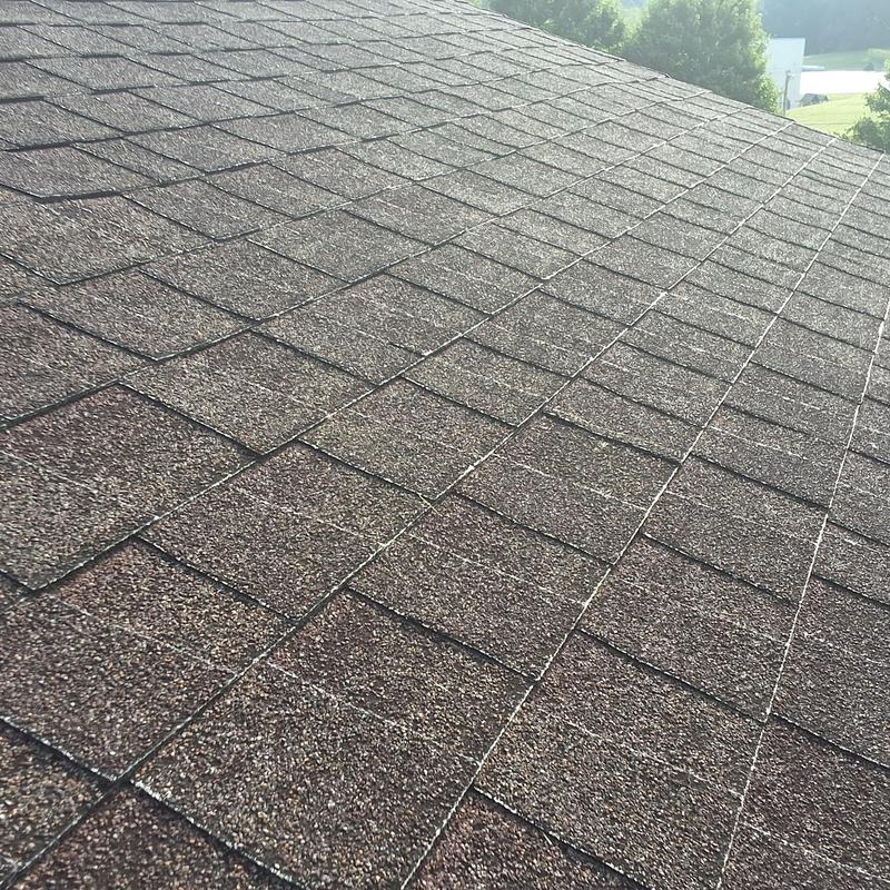 Asphalt shingle roof with wear and leak points visible