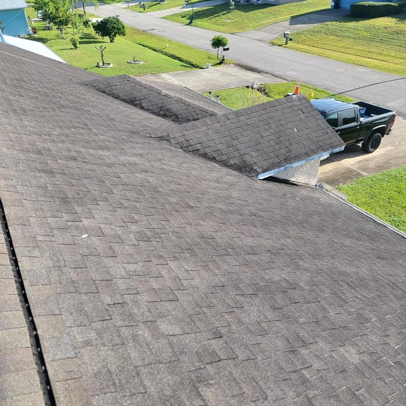 Asphalt shingle roof overview at residential property Asphalt shingle roof overview at residential property