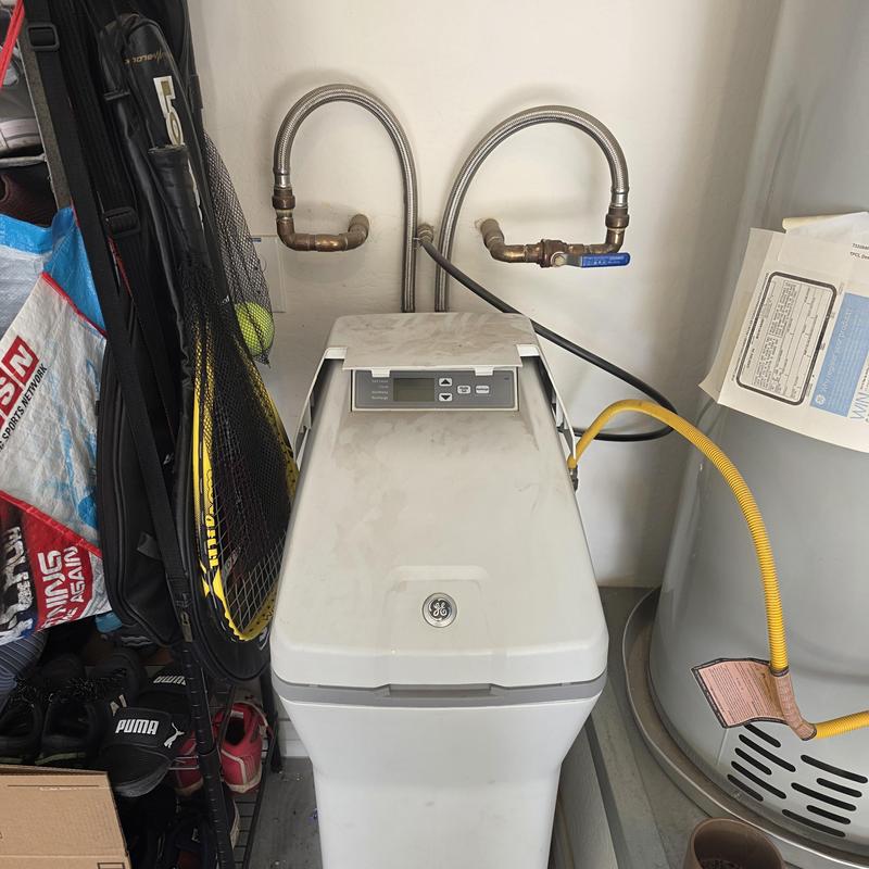 Water softener system with pipes and valves installed