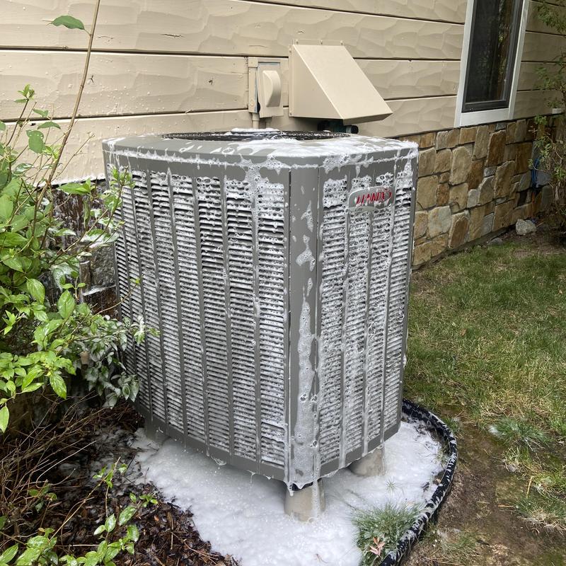 Air conditioner coil cleaning with foam buildup outdoors